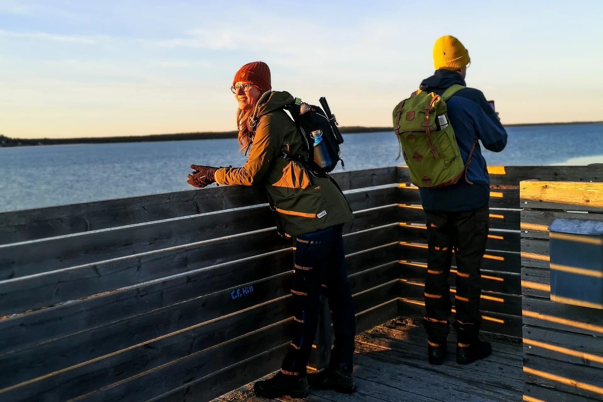 People on bird watching tower overlooking the sea